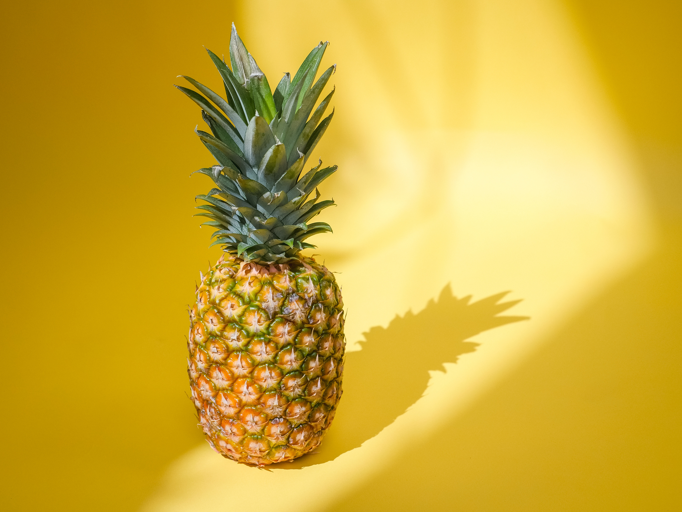 A Pineapple on a Yellow Background 